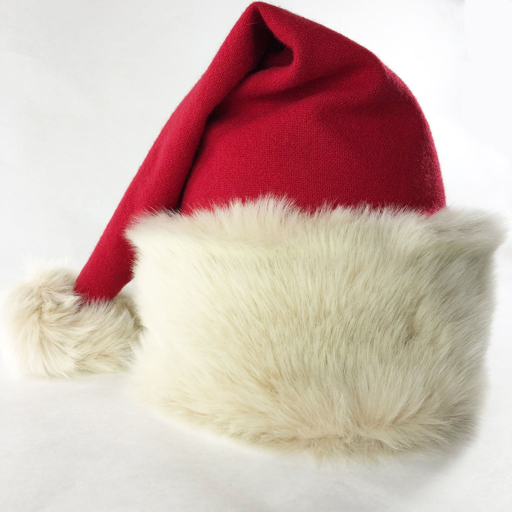 Luxury Santa hat hand-crafted from with ivory faux fur and red merino wool in our London workshop
