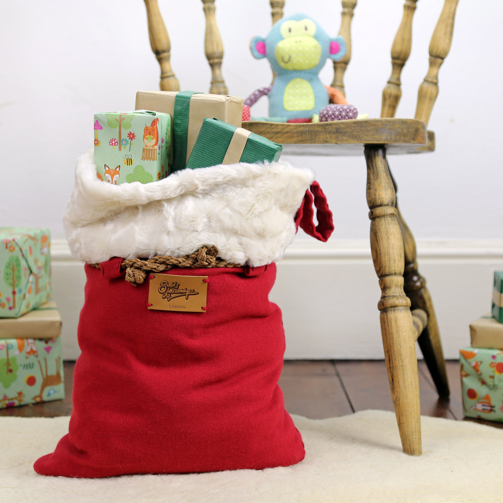 Large Santa sack with luxury faux fur trim filled with presents