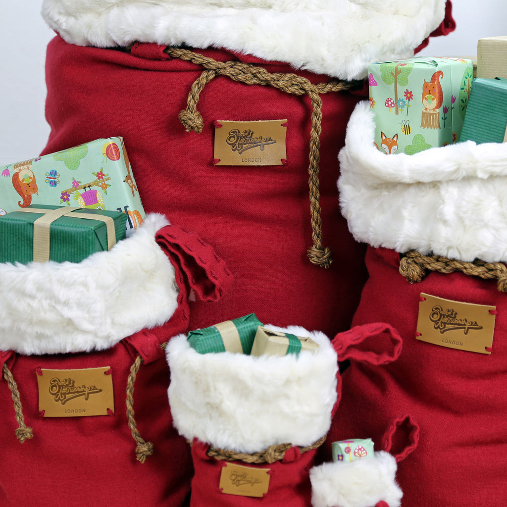 Custom set of Luxury Handmade Christmas sacks with embossed leather patch and twisted cord. Perfect Santa Sack for families or kids or couples.