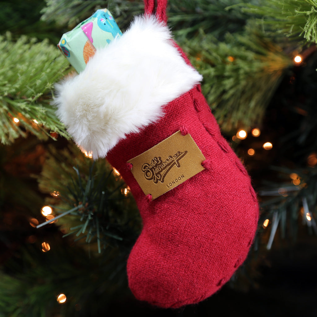 The Mini Stocking from red wool and white faux fur handmade in London by Santa's Little Workshop