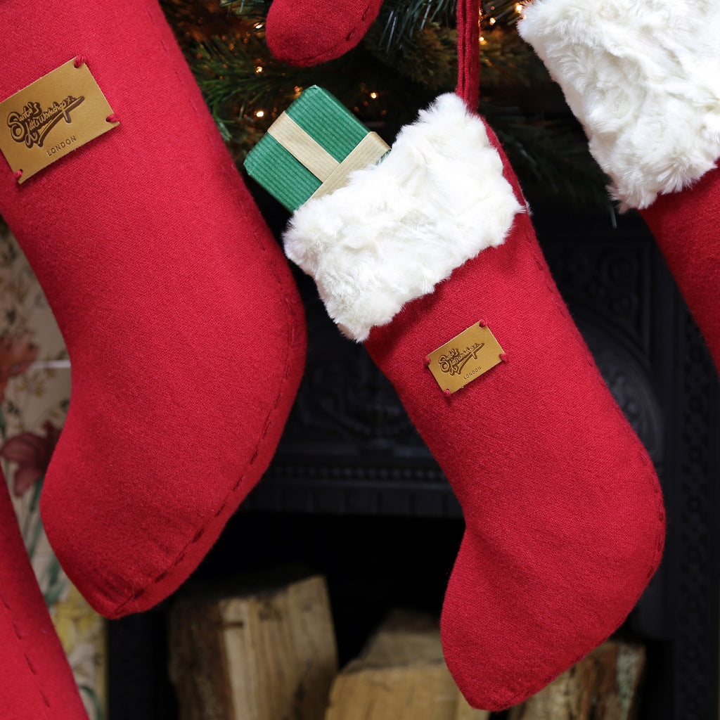 This small luxury Santa Stocking is made from merino wool and white faux fur fabrics, personalised Xmas decorations